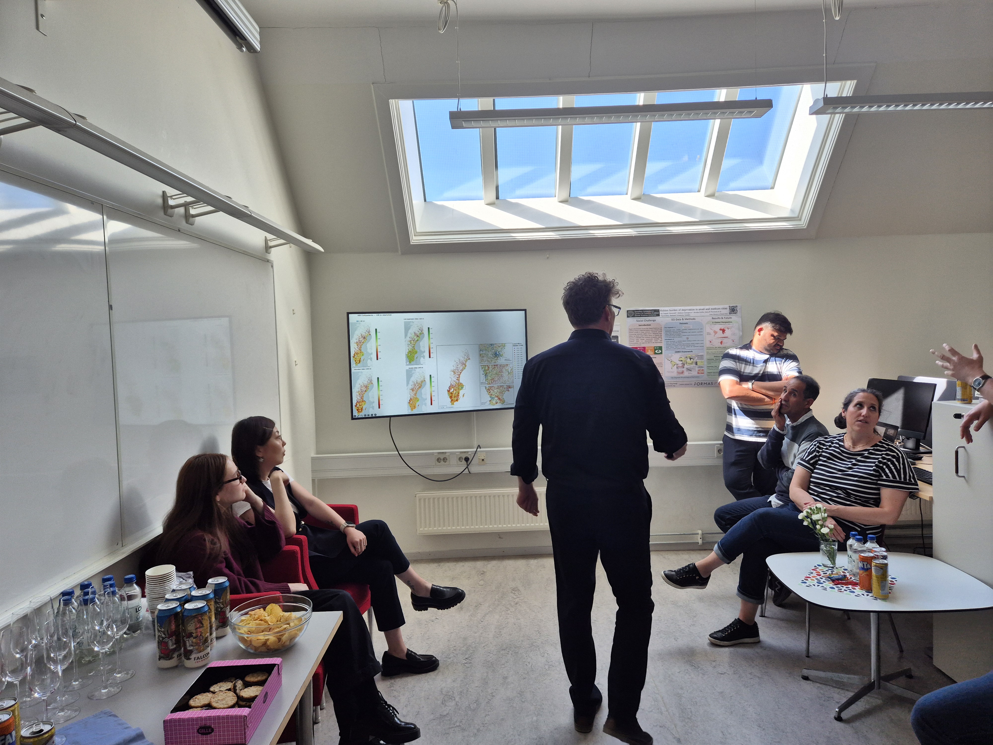 Guests gathered under the skylights in Room 42, with the wall-mounted map visible during the inauguration